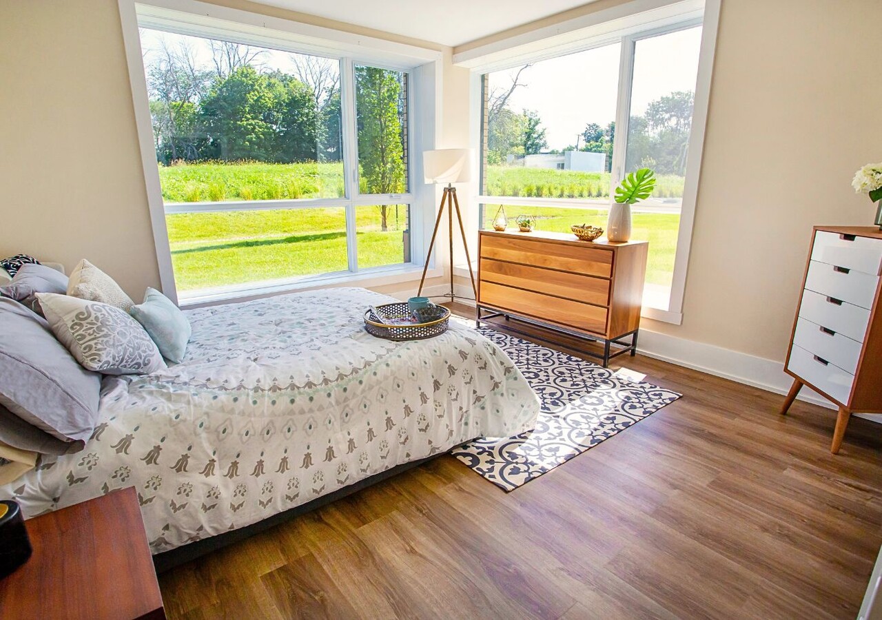 Manoir Pierrefonds bedroom with big windows